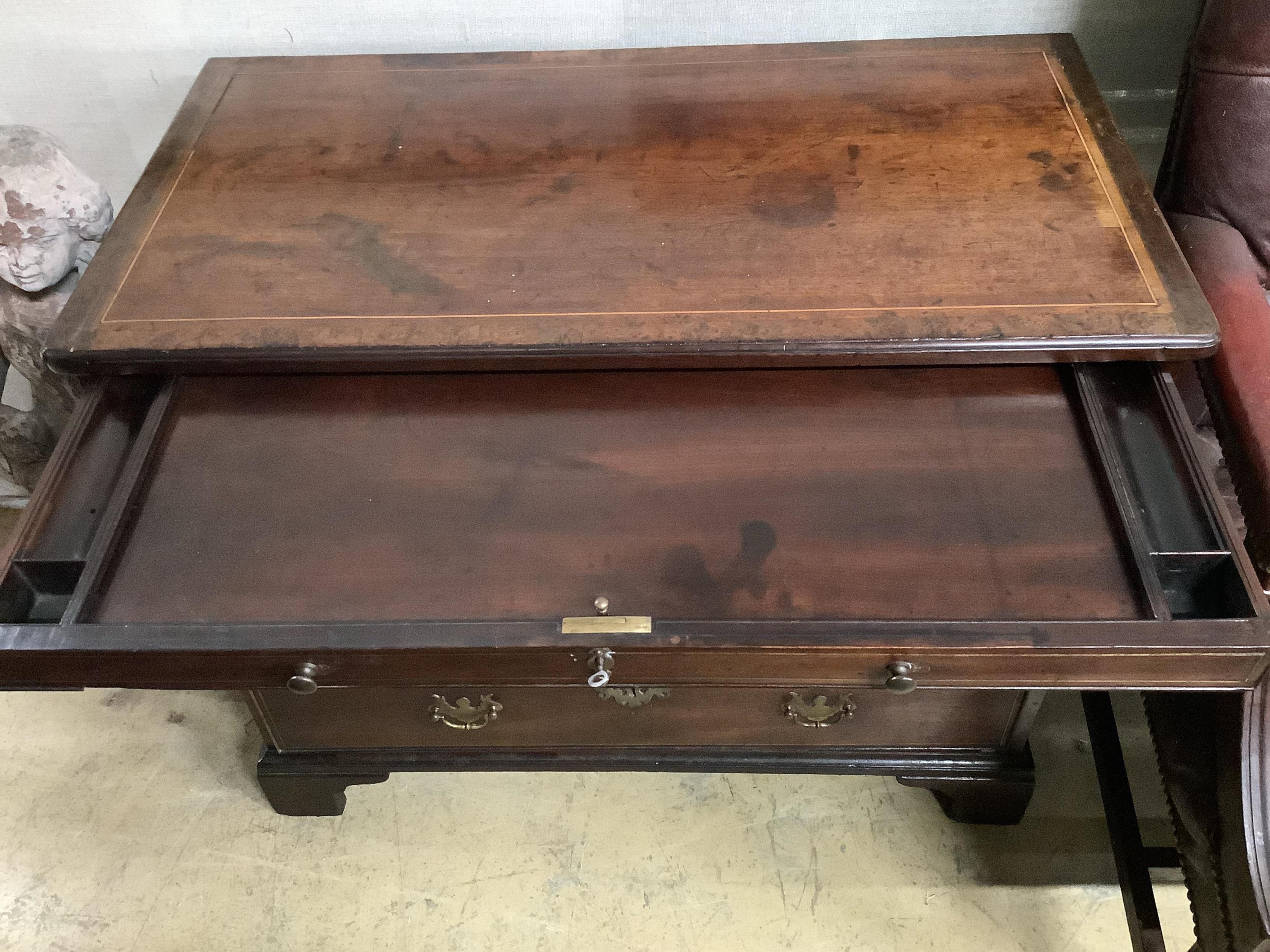 A George III, possibly padouk, brass inlay,dressing chest in the manner of John Channon, width 88cm, depth 47cm, height 74cm. Condition - fair